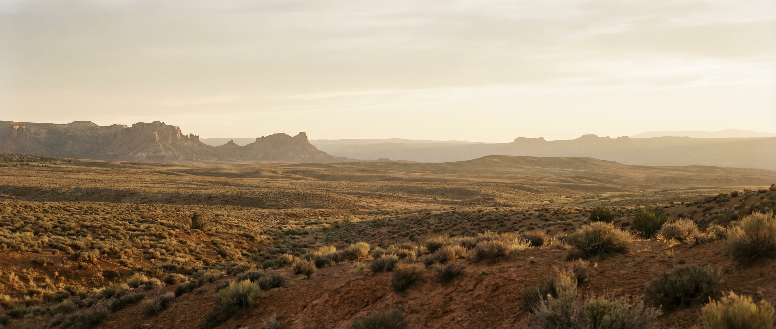 New Mexico high-desert landscape at golden hour, evoking the 'Terra' in Kipu Terra.